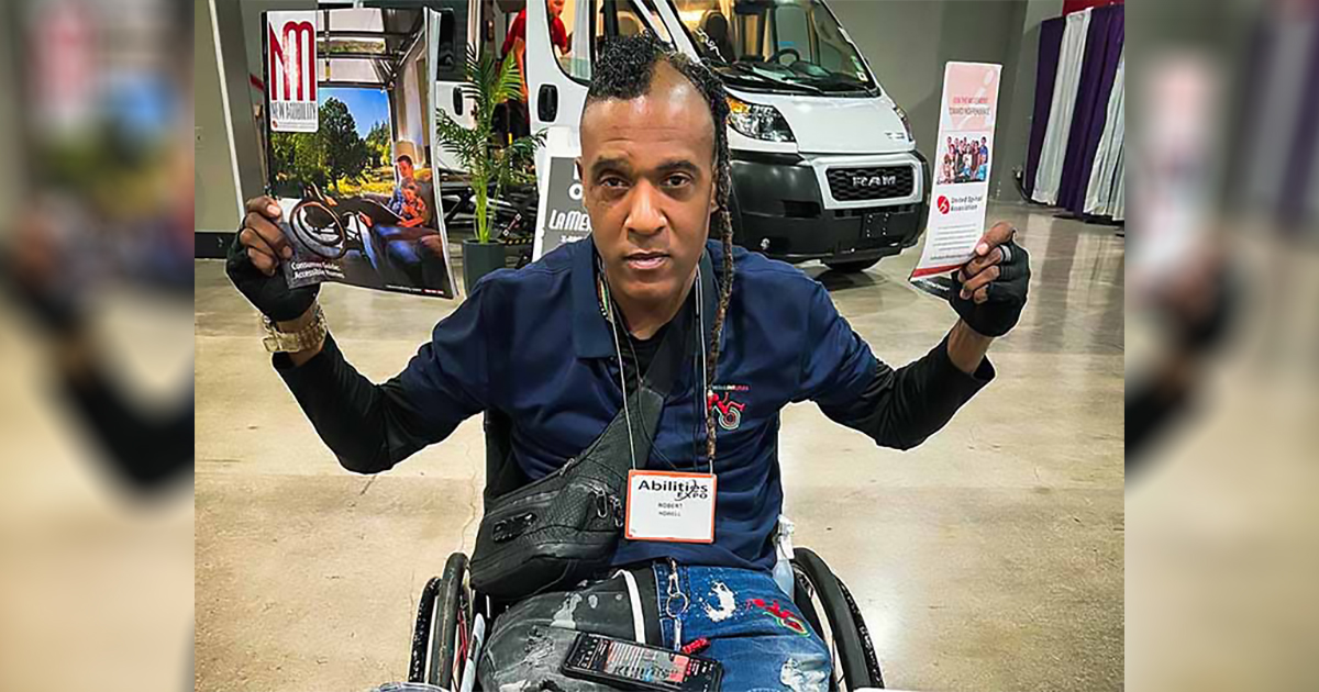 Black man using a manual wheelchair