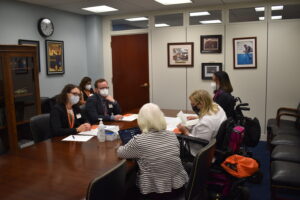 people sitting around office table during Congressional visit