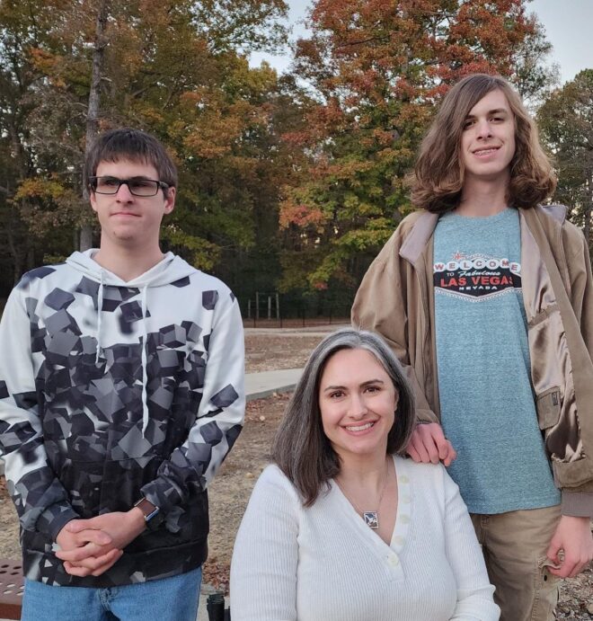Wheelchair-using mom shown with her teenaged sons.