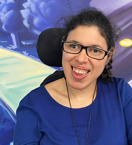 The author wears a dark blue shirt and sports eyeglasses.