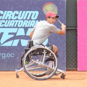 man playing tennis in tennis wheelchair 