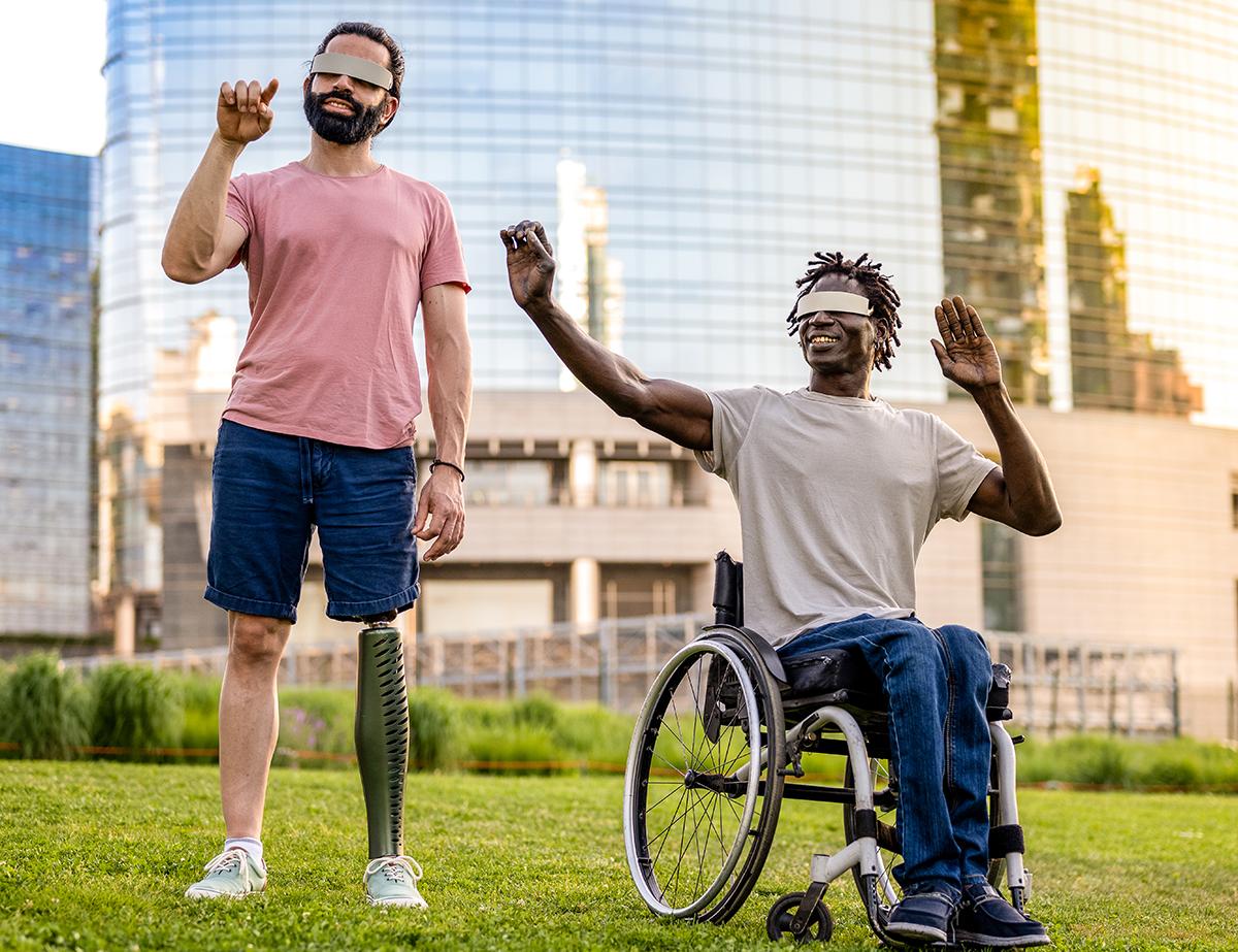 two friends who have a different disability using modern technology headsets, trying virtual reality outdoors, modern skyscrapers as background