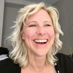 Char Vine smiles at the camera