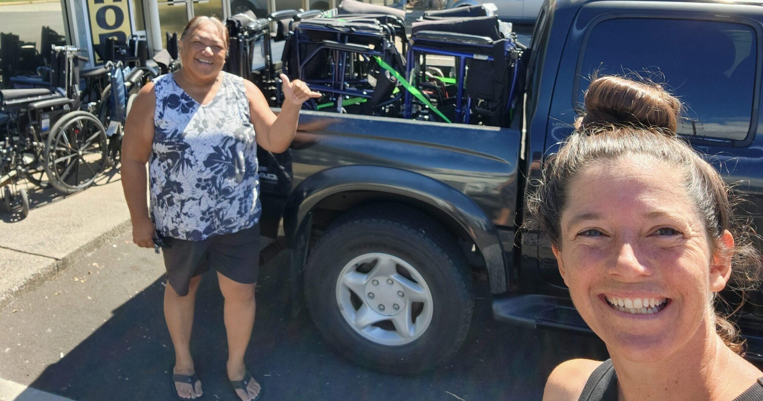 Volunteers from the Kelea Foundation with wheelchairs.