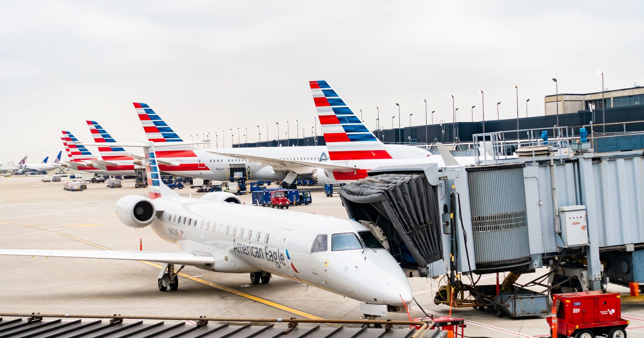 American Airlines planes finishing up for take-off at gate