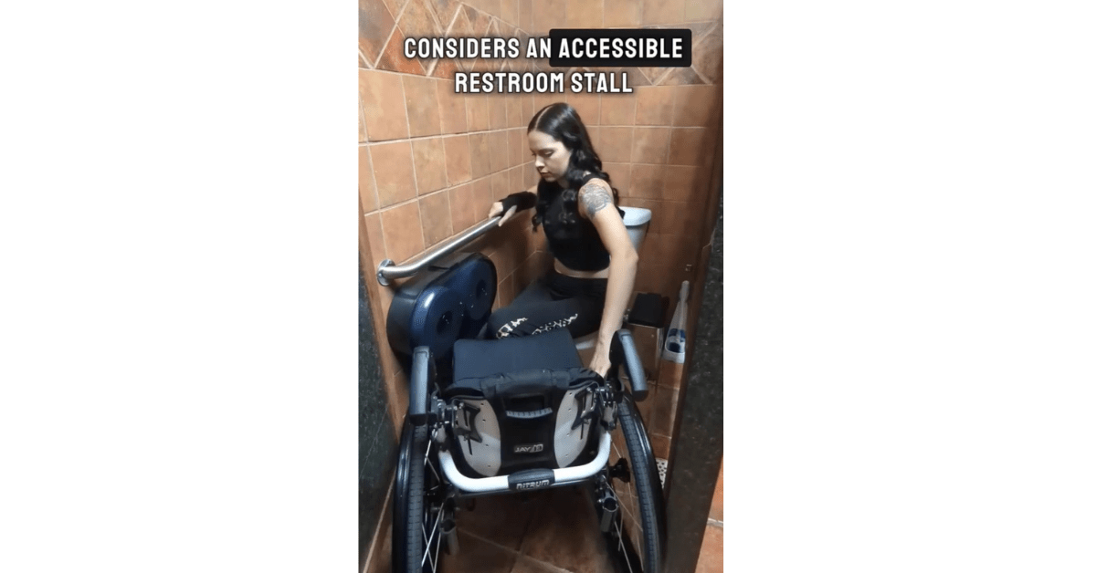 Women in a wheelchair navigates an inaccessible bathroom
