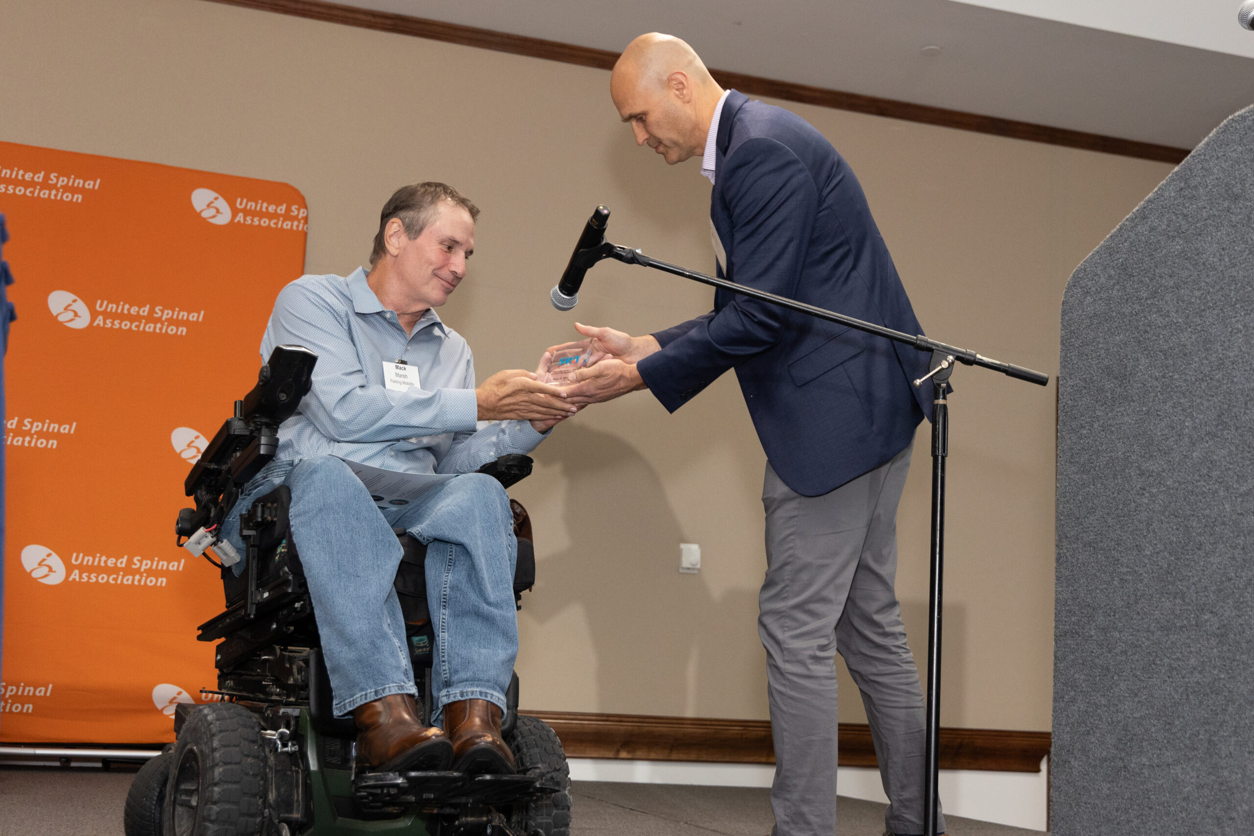 A man in a powerwheelchair at the StrongWheeled Together Awards