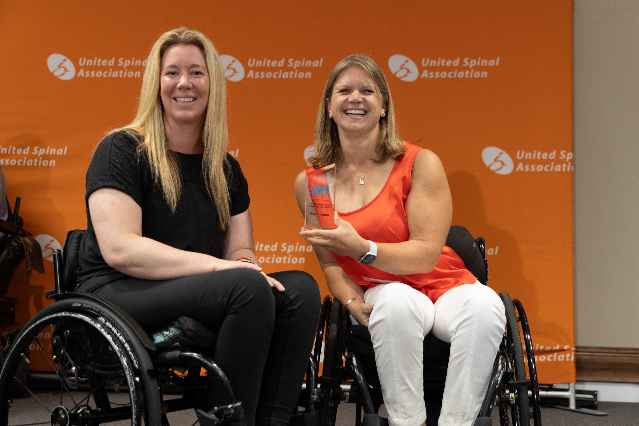 Two women in wheelchairs at the StrongWheeled Together Awards